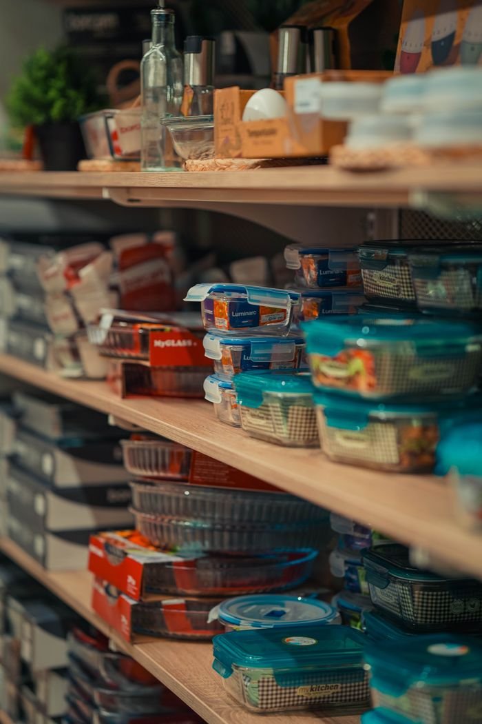 services-img Neatly arranged storage containers on pantry shelves showcasing home organization.